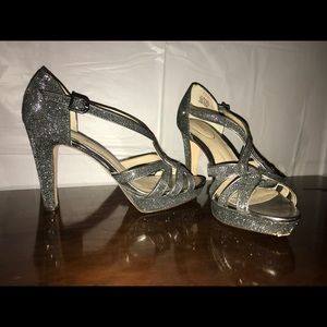 Size 6.5 like new beautiful silver shimmer heels.